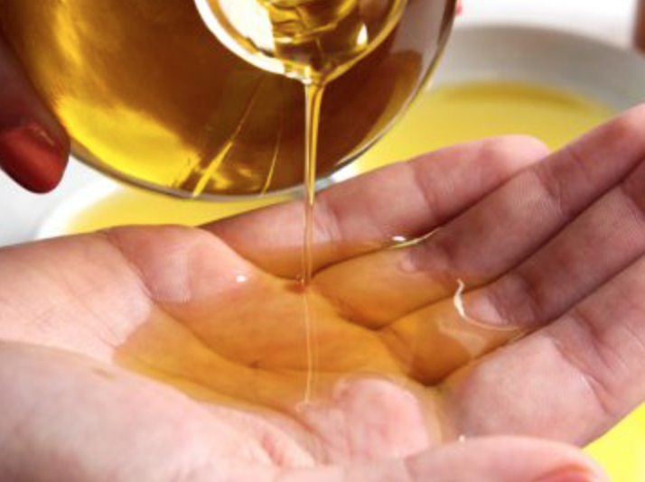 Oil being poured into a hand
